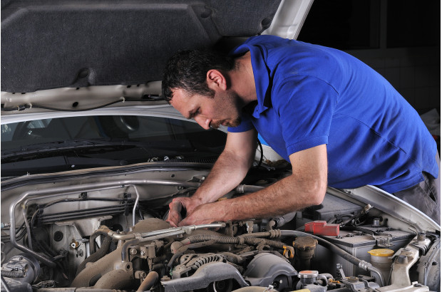 bigstock-Car-mechanic-working-on-a-car--19473542 (1).jpg